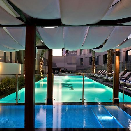 الشقق الفندقية دبيفي  داماك مايسون ذي فوغ المظهر الخارجي الصورة The pool at the hotel