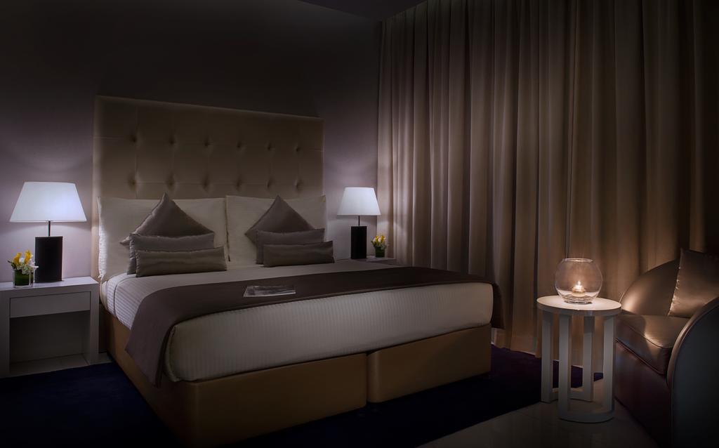 الشقق الفندقية دبيفي  داماك مايسون ذي فوغ المظهر الخارجي الصورة A bedroom at the hotel