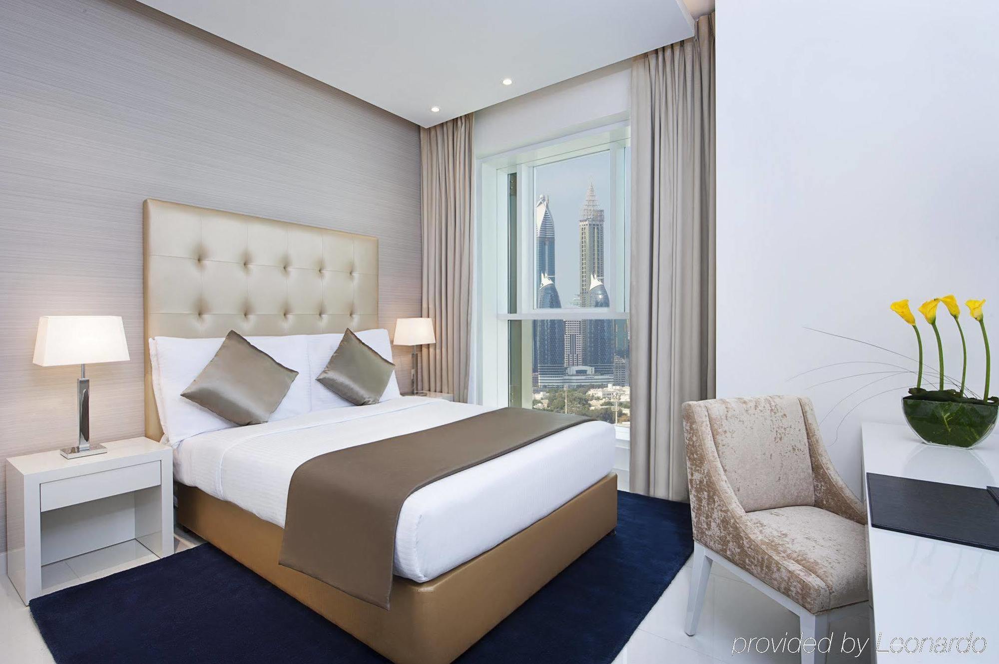 الشقق الفندقية دبيفي  داماك مايسون ذي فوغ المظهر الخارجي الصورة A bedroom at the hotel
