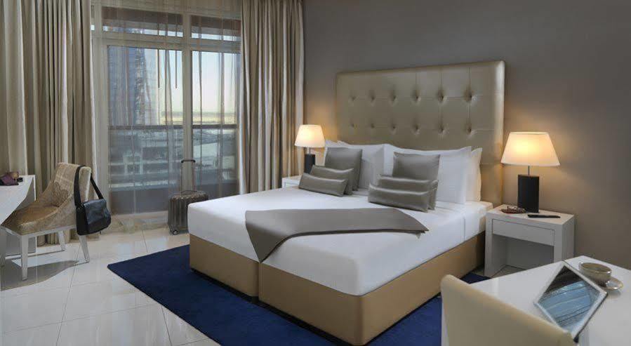 الشقق الفندقية دبيفي  داماك مايسون ذي فوغ المظهر الخارجي الصورة A bedroom at the hotel
