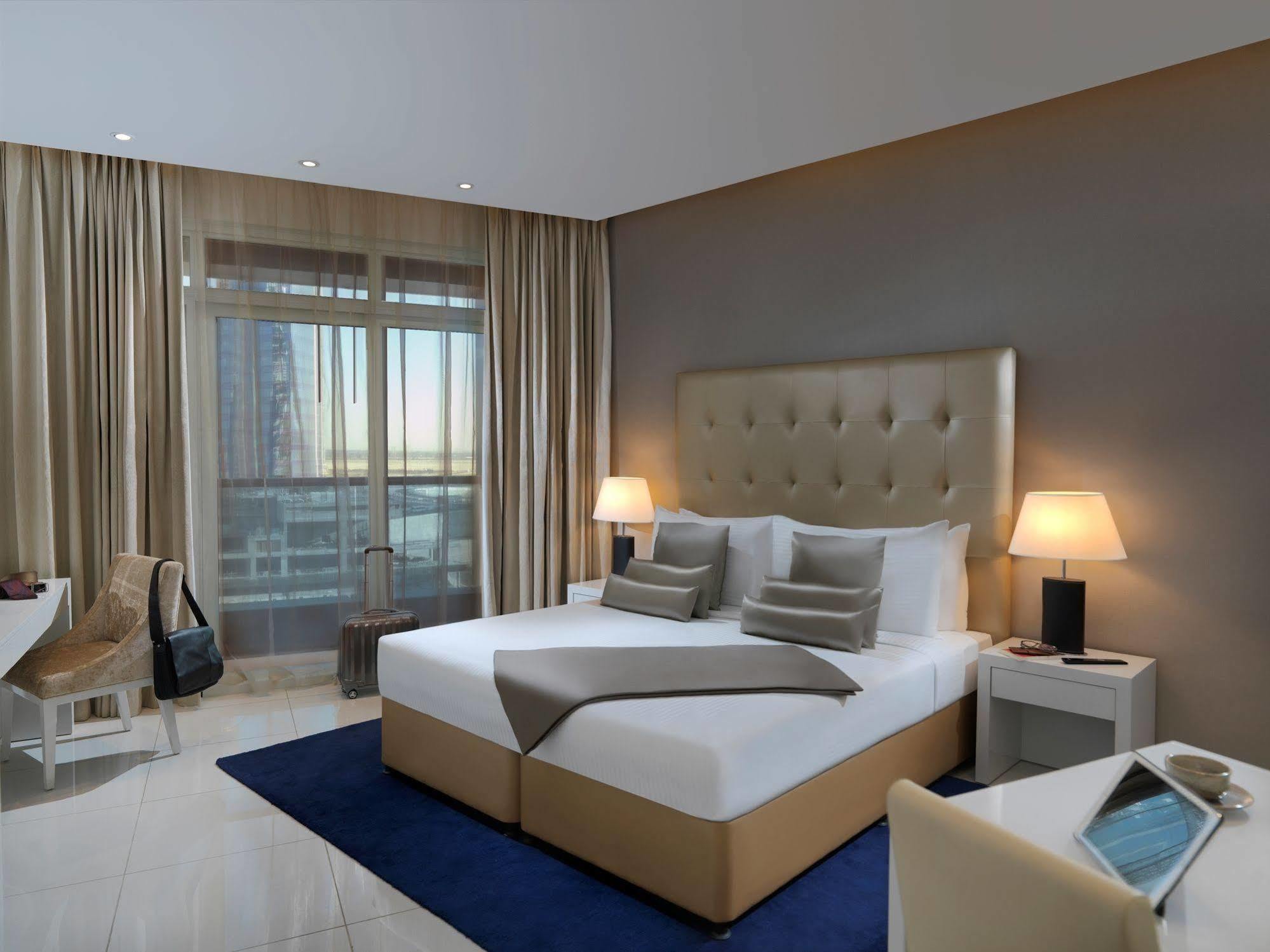 الشقق الفندقية دبيفي  داماك مايسون ذي فوغ المظهر الخارجي الصورة A bedroom at the hotel