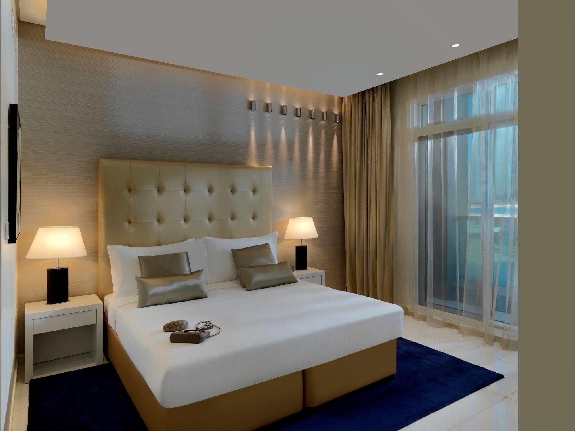 الشقق الفندقية دبيفي  داماك مايسون ذي فوغ المظهر الخارجي الصورة A bedroom at the hotel